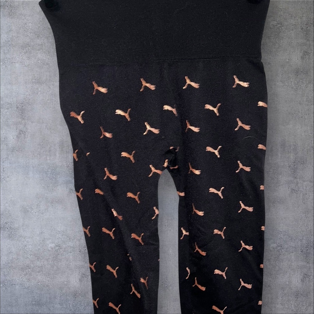 Puma Black Leggings with Gold Logo Pattern